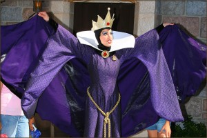 The Evil Queen blocking guests with her cape