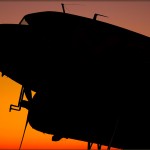 C-53D Skytrooper 'D-Day Doll' backlit by the sunset