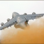 With a massive dust cloud trailing behind it, a C-17 Globemaster III takes to the skies over the 2008 Riverside Airshow