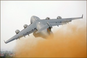 With a massive dust cloud trailing behind it, a C-17 Globemaster III takes to the skies over the 2008 Riverside Airshow