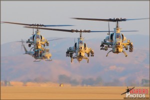 AH-1W Cobras hover in to their landing spots followed by UH-1N Hueys