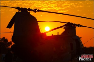 The sun sets in the San Diego sky behind a CH-46E Sea Knight at MCAS Miramar