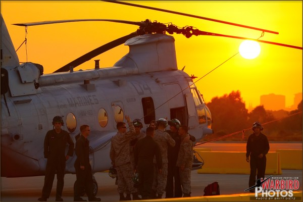 The sun sets in the San Diego sky behind a CH-46E Sea Knight at MCAS Miramar