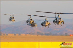 AH-1W Cobras hover in to their landing spots followed by UH-1N Hueys