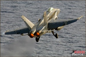 An F/A-18c Hornet is launched off the deck of the USS Abraham Lincoln Aircraft Carrier
