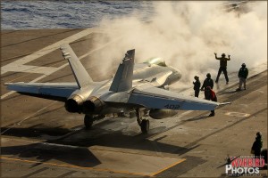 An F/A-18C Hornet preps for being launched off the deck of the USS Abraham Lincoln Aircraft Carrier
