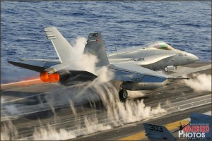 An F/A-18C Hornet launches off the USS Abraham Lincoln Aircraft Carrier