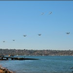 Marine CH-53 Super Stallions and C-130K Hercules pass in review for the Centennial of Naval Aviation Celebration 2011