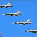 Four US Marine F/A-18C Hornets pass for the Centennial of Naval Aviation Celebration 2011