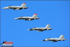 Four US Marine F/A-18C Hornets pass for the Centennial of Naval Aviation Celebration 2011