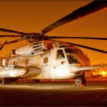 A Sikorsky CH-53E Super Stallion sits at night at the Gillespie Field Airport