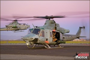 A Bell UH-1Y Venom seconds before lifting off with a Bell AH-1Z Viper heading off in the rear at the MCAS El Toro / Great Park airshow